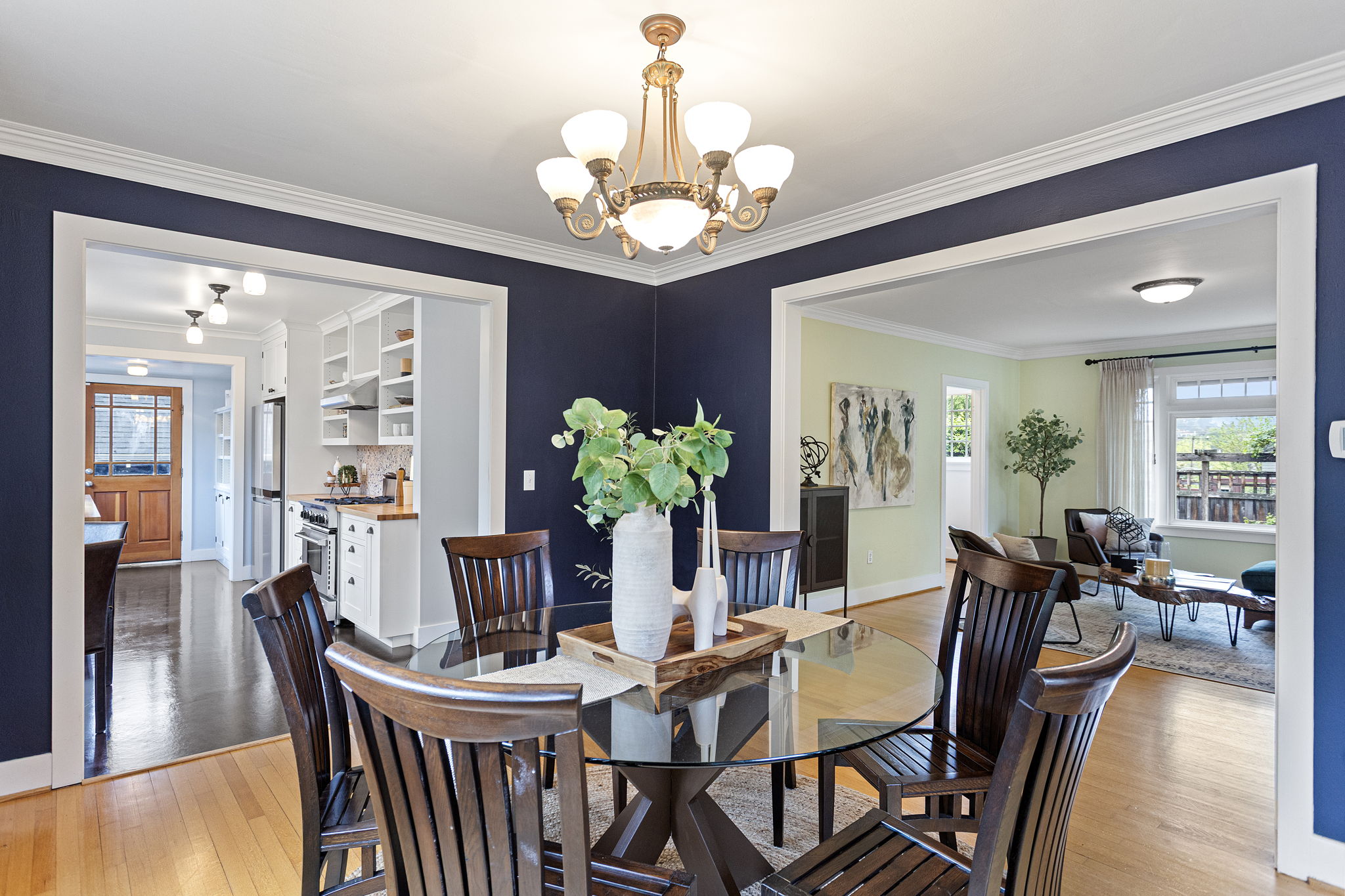 From the dining table: kitchen left, living room right. Now you see it — the circular plan doing exactly what it promised.