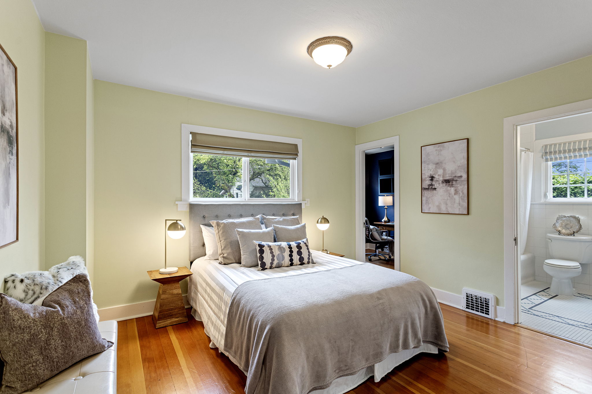 One room, three glimpses — bedroom, flex space, bath. The circular floor plan isn't an abstraction. This is what it looks like.