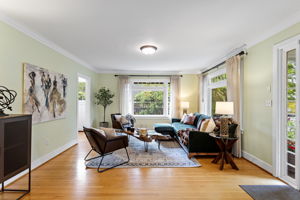 Quarter-sawn white oak floors. Crown molding, full perimeter, uncompromised. A hundred years and nobody touched the wrong thing.