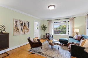 Corner lot light, two wall exposures. The floor plan doesn't force a conversation — it just makes one easy.