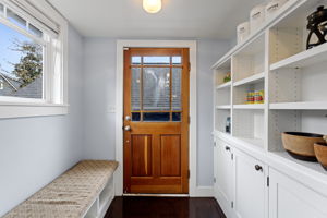 Divided lite Craftsman back door, built-in bench, floor-to-ceiling pantry. Everything you need before you hit the deck.