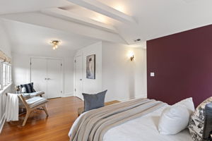 Two closets and a wall sconce. The primary bedroom covered the practical side without making a fuss about it.