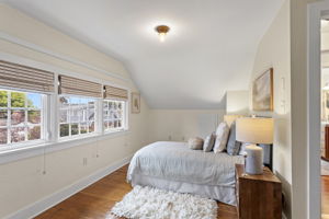 The roofline angles in. The triple window bank angles back. Original red fir floors run straight through. Nobody lost anything up here.