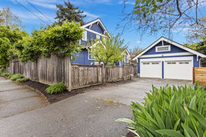 Two-car garage, concrete driveway, sub-panel, 240V outlet, Level 2 EV charger-ready, pull-down ladder to a large attic with real headroom. The parking situation is solved. (The attic is a conversation for another day.)
