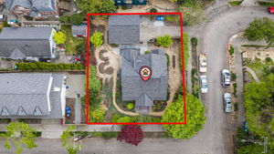 A Commanding Hilltop Estate: This level 6,840 sq. ft. corner lot is an organic gardener’s dream, elevated at the crest of the hill to capture light from all directions. The expansive grounds feature professional hardscaping and RainWise certified systems that frame the lush, private yard. The detached 2-car garage and driveway also provide a versatile footprint for future DADU potential, offering a rare balance of established beauty and long-term growth.