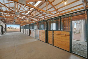NE wing of barn  with pipe fence runs on east wall stalls