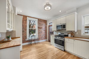 Spacious, updated, eat-in kitchen opens to patio