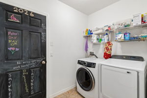 Laundry room with chalkboard painted door