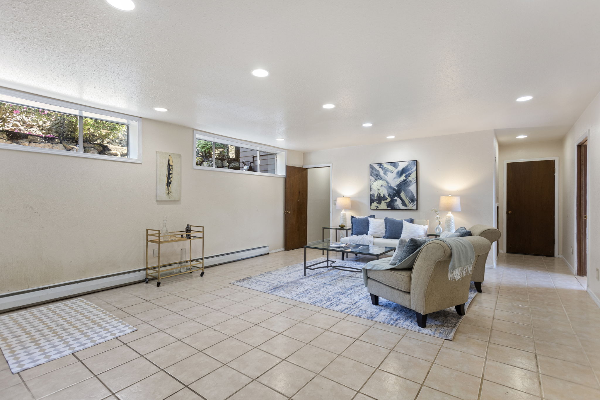 The rec room keeps going — and so do the options. Extended living, multigenerational rhythm, rental potential — the layout makes the questions feel practical. Buyer to verify all uses and permitting.