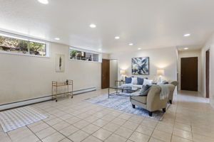 The rec room keeps going — and so do the options. Extended living, multigenerational rhythm, rental potential — the layout makes the questions feel practical. Buyer to verify all uses and permitting.