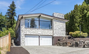 1965. Stone. Glass. Still the most interesting house on the block.