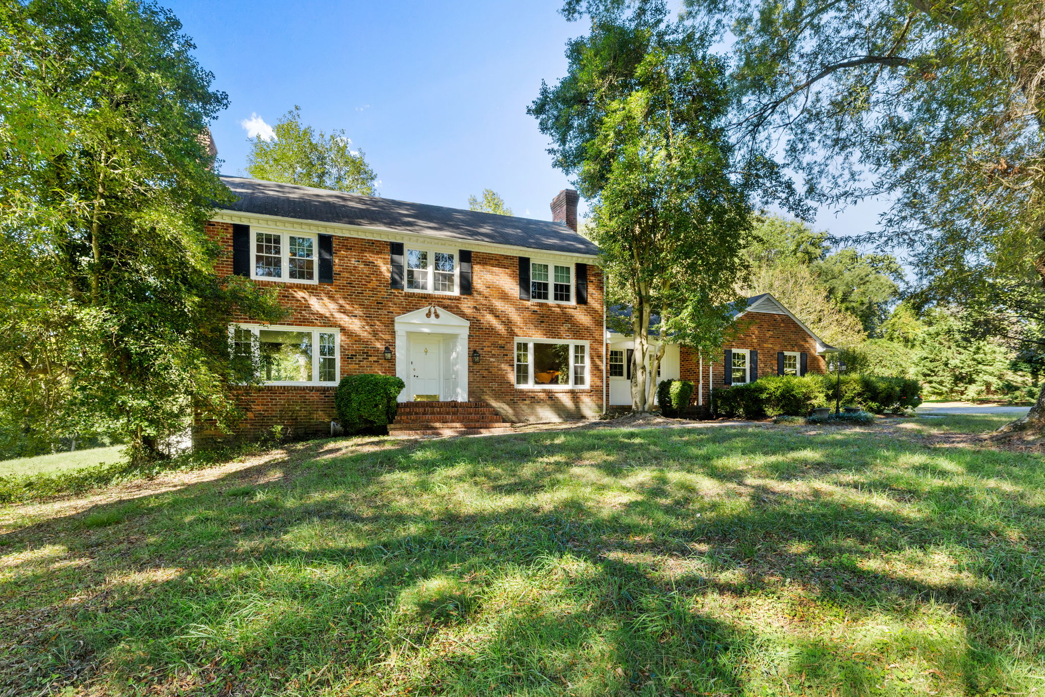 Park-like setting on nearly 4 acres