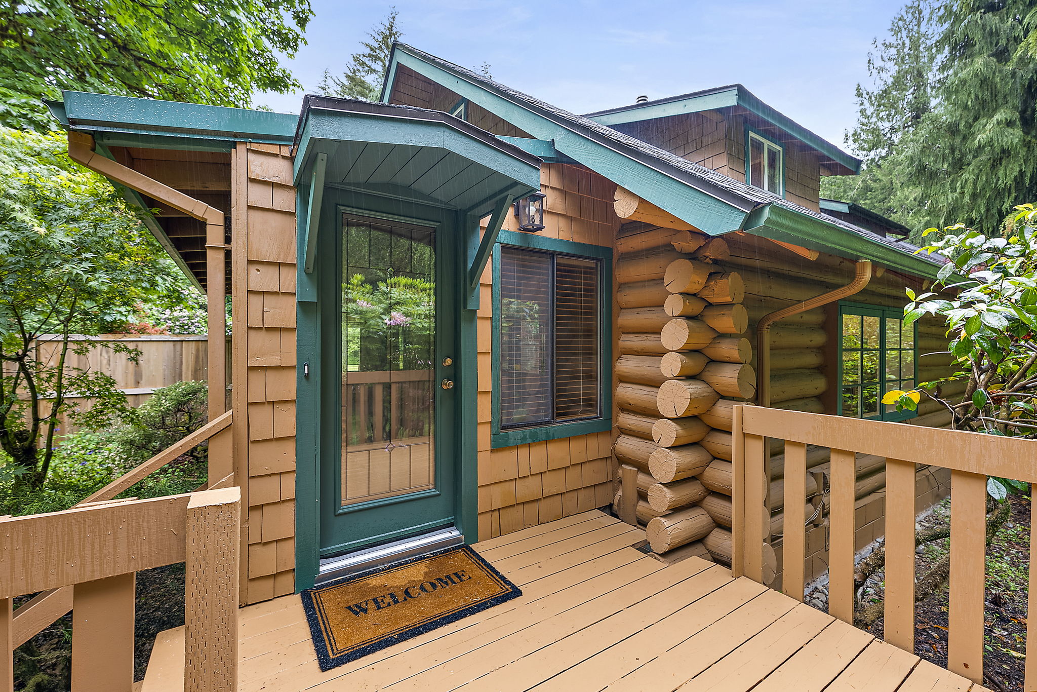 New exterior paint and front porch doors. Lead to enclosed porch.