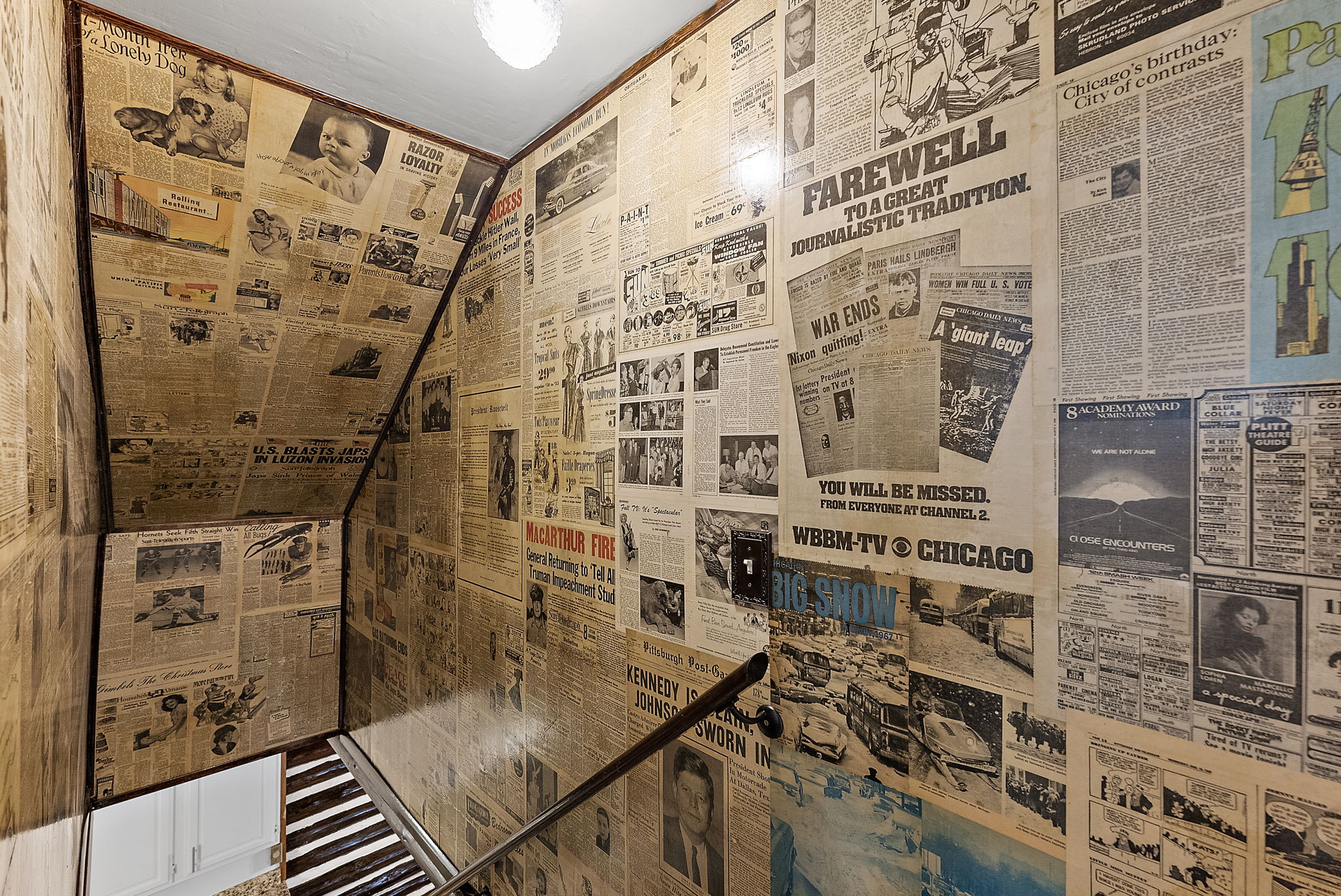What a treat! These are original newspapers that were artfully decoupaged by the seller. Check out some amazing history on these walls!