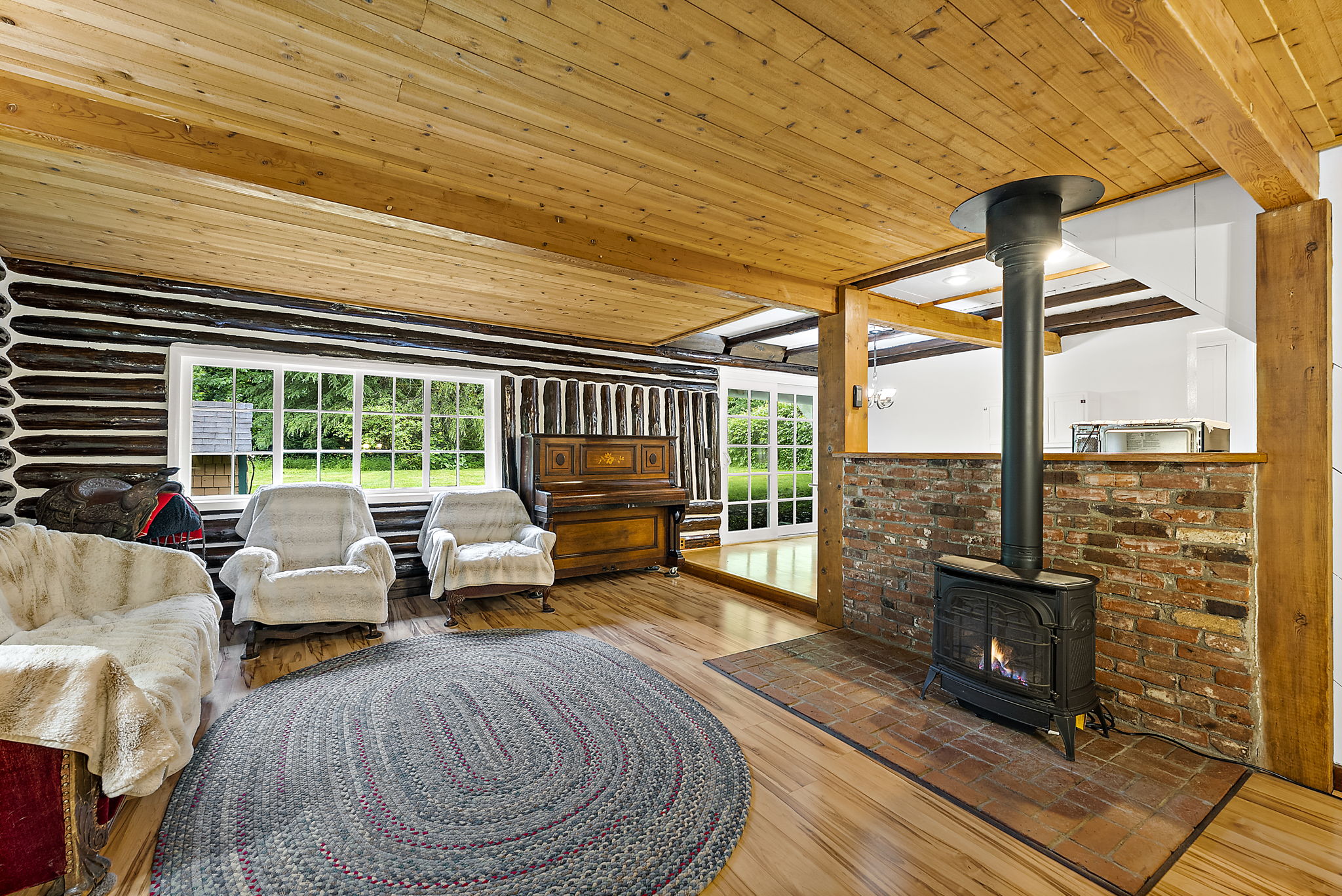 Gas stove cozy ups this inviting space.