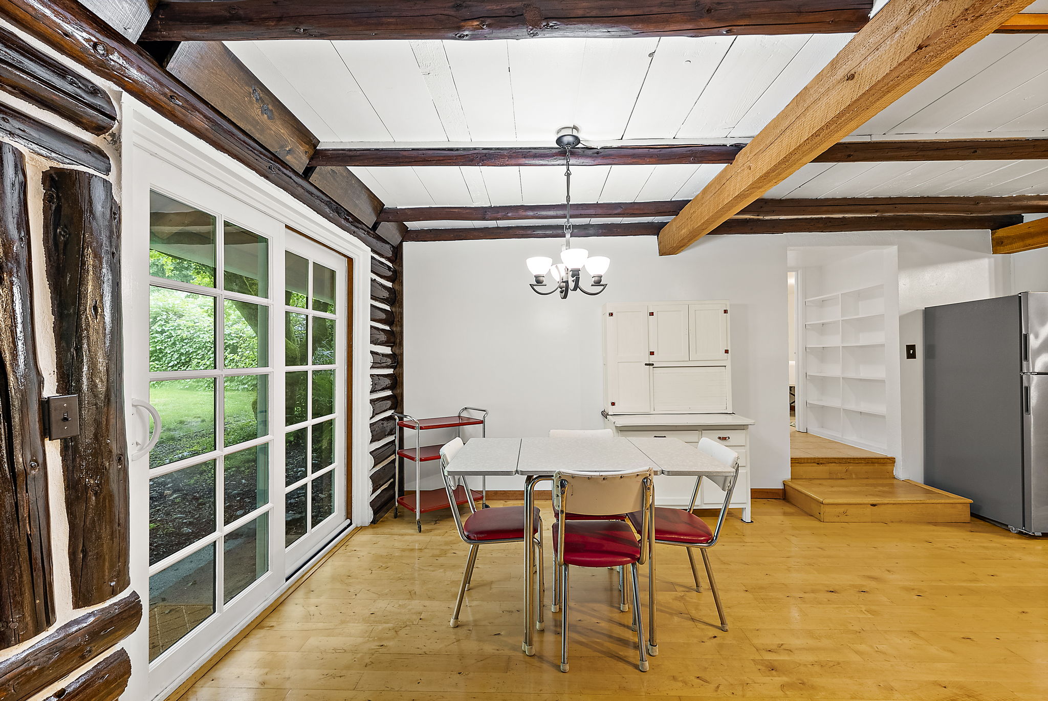 Patio doors to backyard, off kitchen.