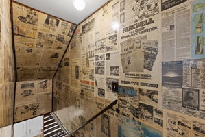 What a treat! These are original newspapers that were artfully decoupaged by the seller. Check out some amazing history on these walls!