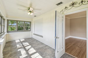 Beautiful sunroom with AC and ceiling fan