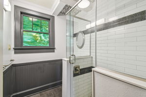 Full bathroom features subway and art deco style tile