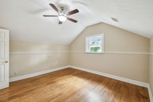 Primary bedroom on 2nd floor with vaulted ceiling