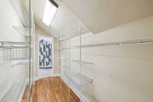 Primary walk-in closet opens to en-suite bathroom