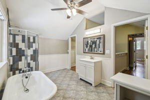 Large primary bathroom with vaulted ceiling