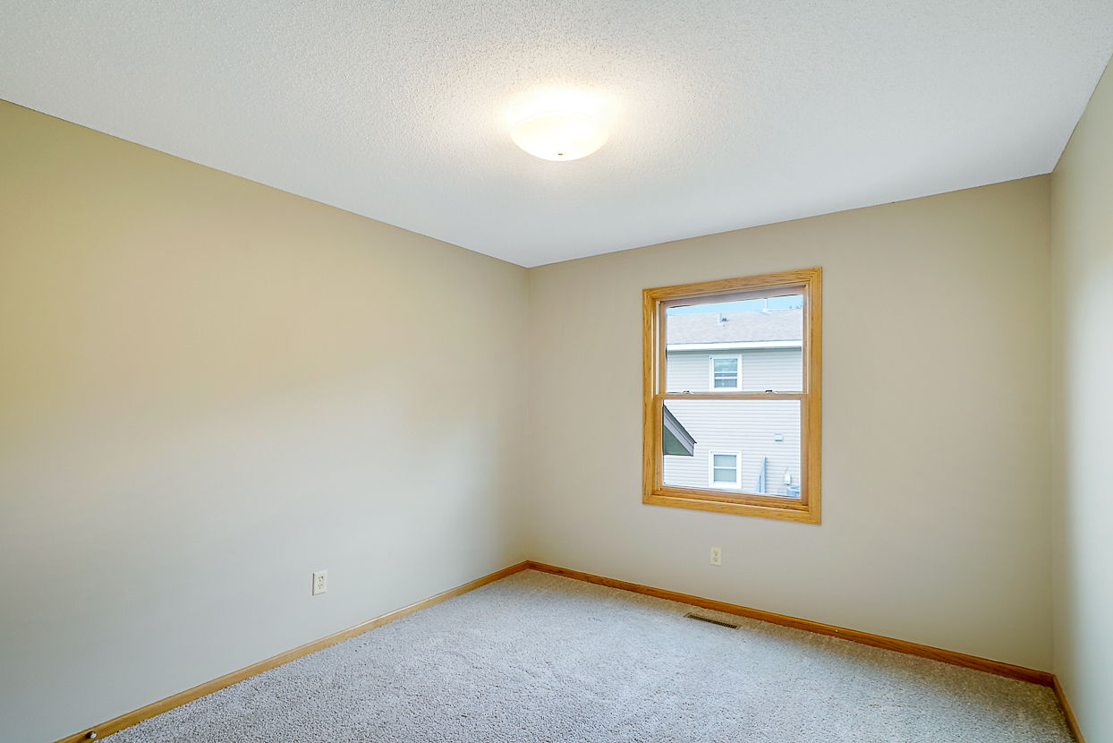 The second Upper Level Bedroom is the perfect size for younger people or as an Office.