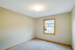 The second Upper Level Bedroom is the perfect size for younger people or as an Office.
