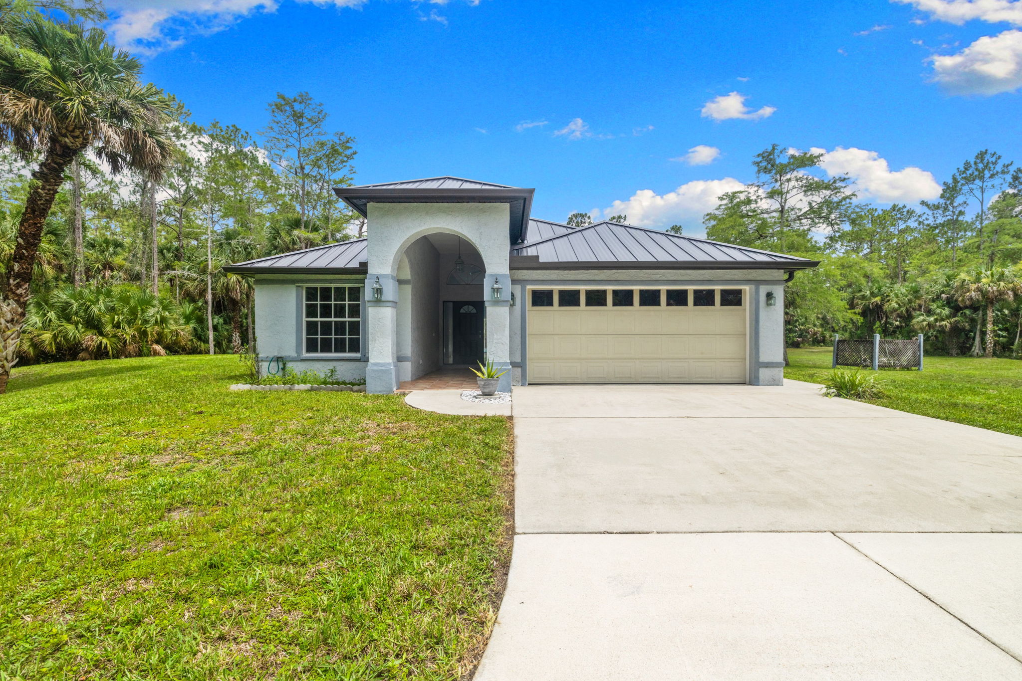 Single-story concrete block home with new metal roof