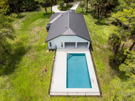 15’ x 30’ x 8’-deep pool, surrounded by a spacious patio