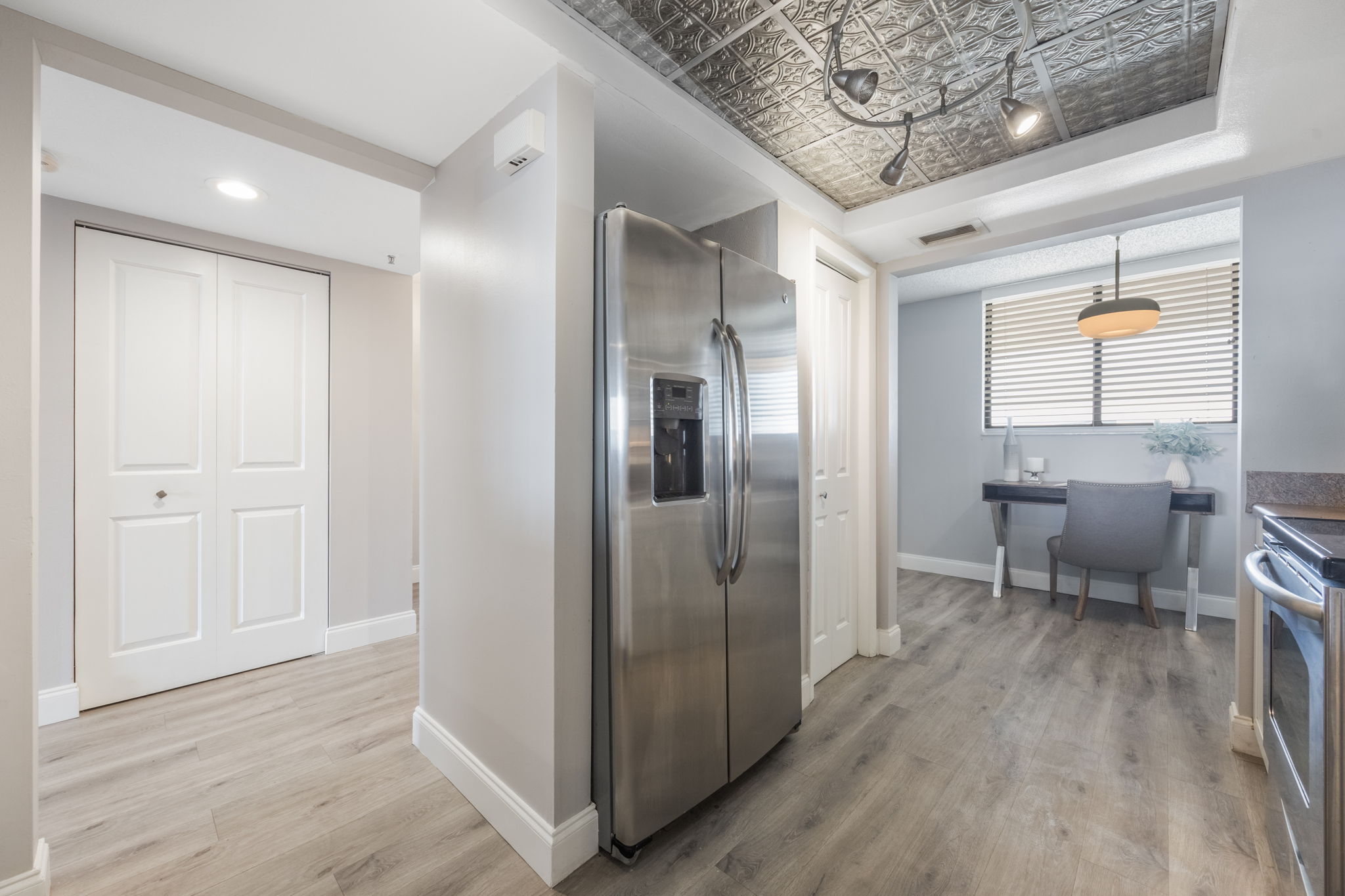 Kitchen view to foyer on left and breakfast nook/FLEX office nook to the right.