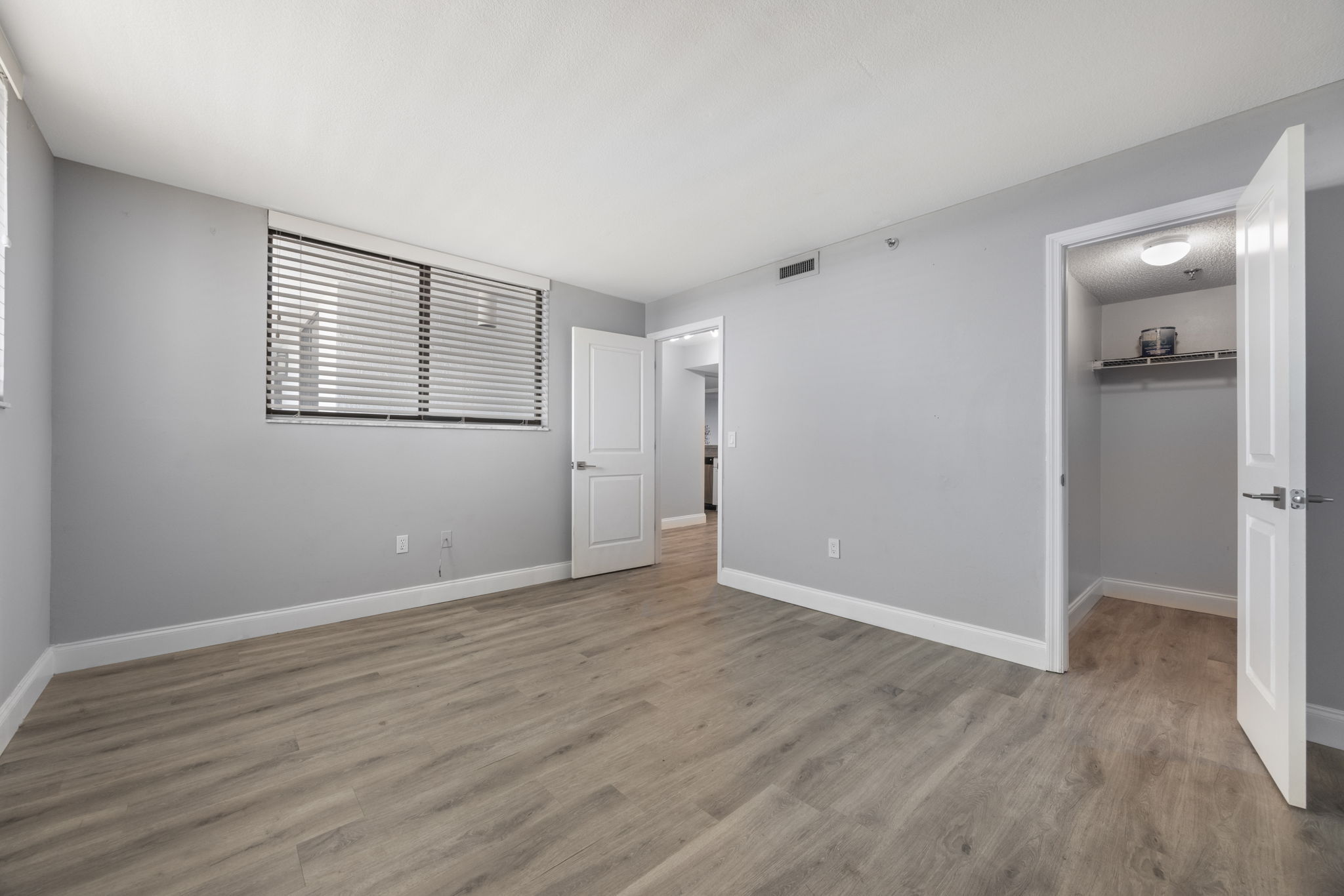 Secondary bedroom features walk-in closet.