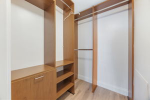 Primary suite custom walk-in closet.
