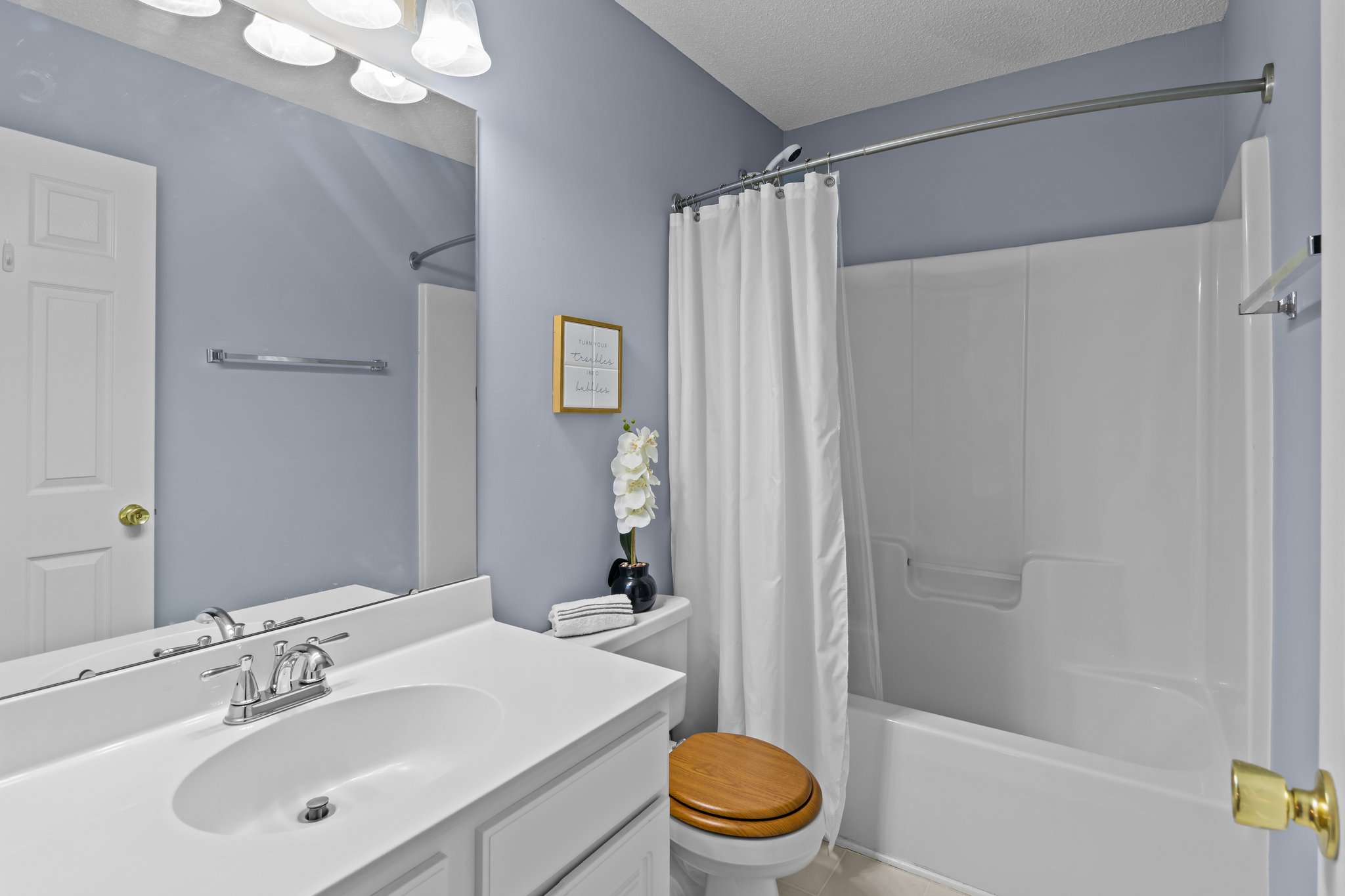 Upstairs hall access bathroom.