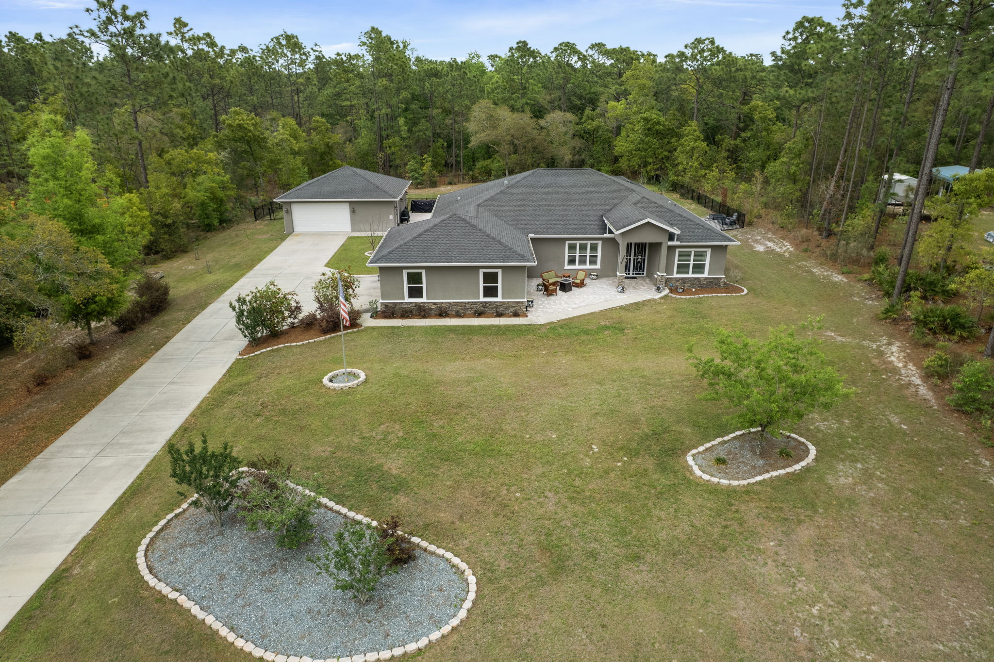 Situated on 1 acre homesite with an attached 2 car garage, and a detached 2+ car garage.