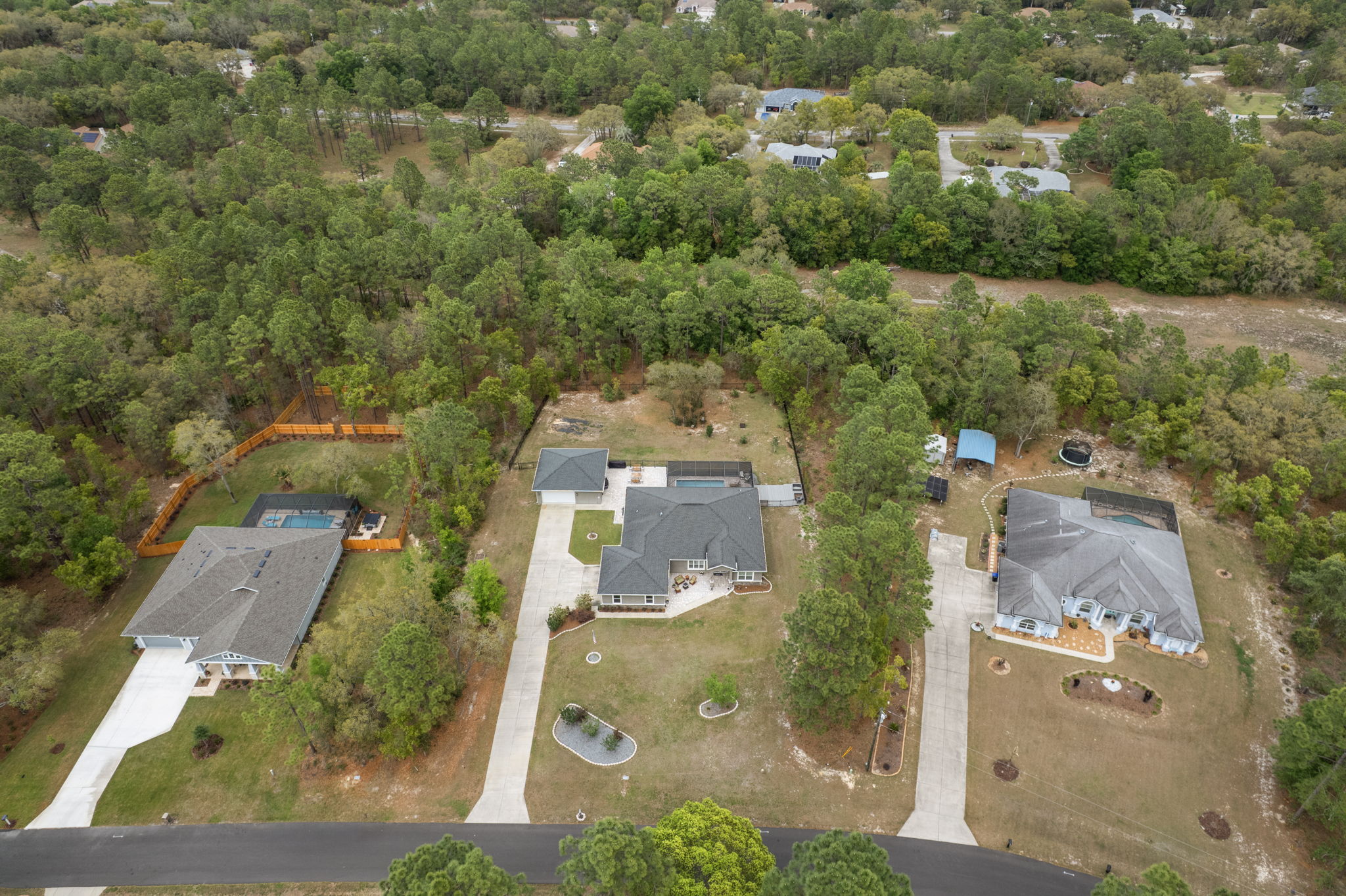 Front aerial view provides better view of vacant land behind lot that cannot be developed.