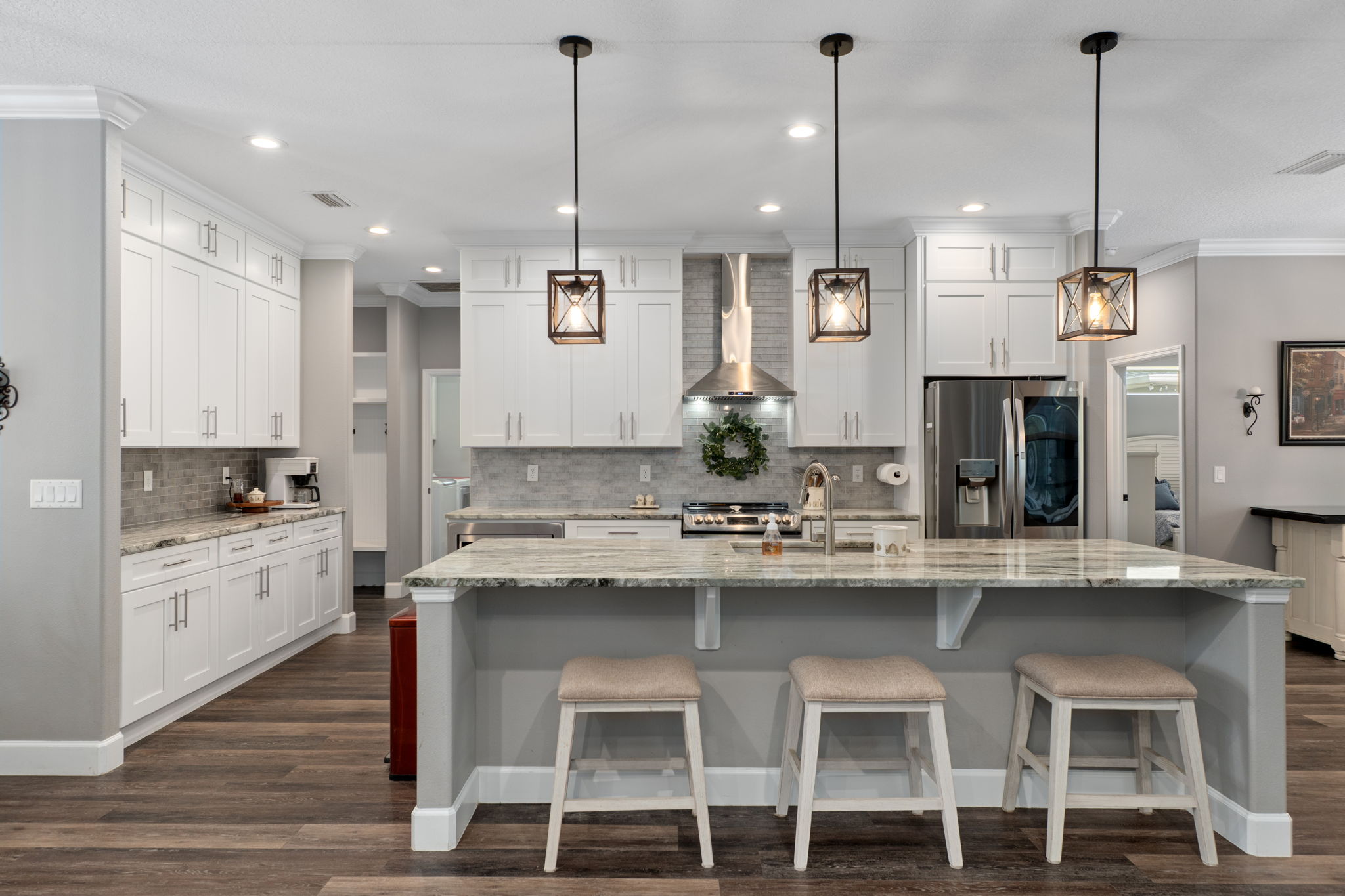 The kitchen provides great storage, a single level island, newer stainless steel appliances, and is a cook's dream!