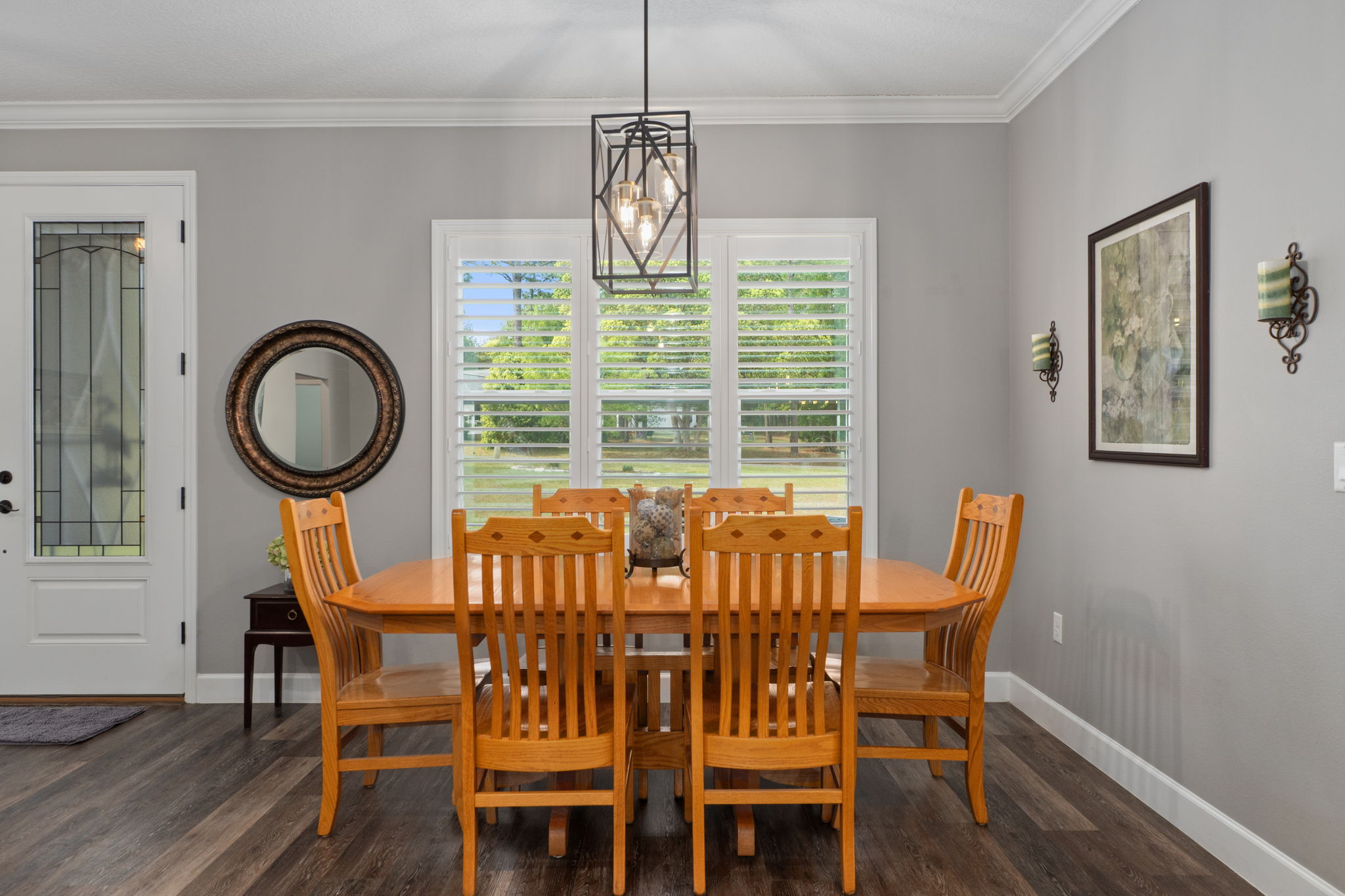 The dining room, just inside the front entry, overlooks the front patio. It is open to the great room. If a formal dining room is not something you need, the space can easily become a library, bar, or whatever you need it to become.