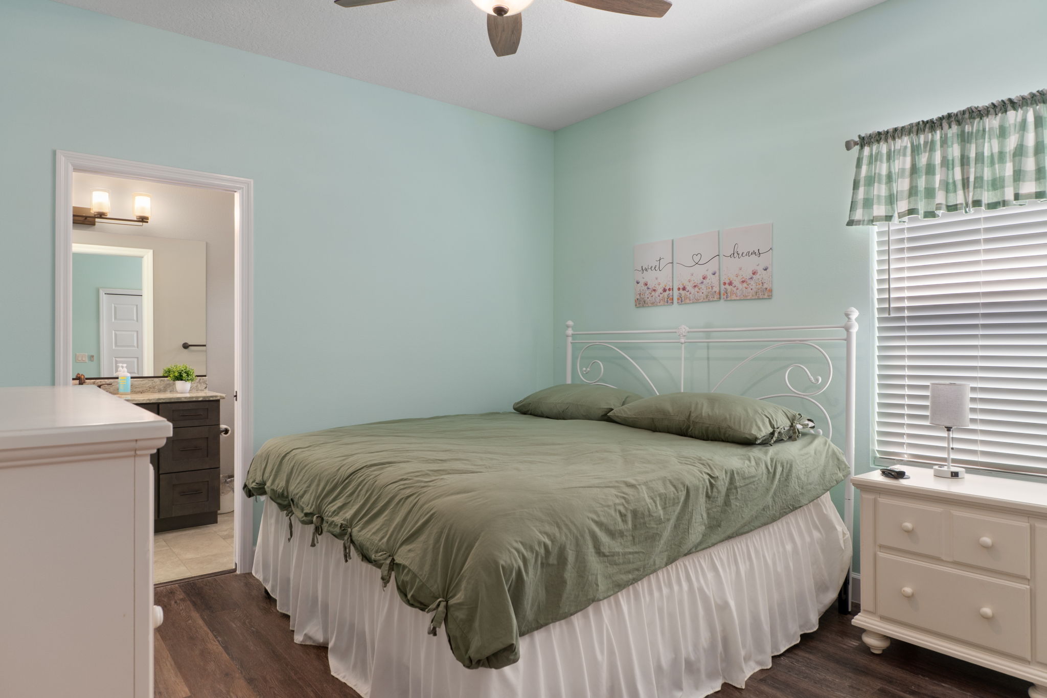 The second guest bedroom is the same size - here with a king size bed - but features it's own bathroom that also serves as a pool bath.