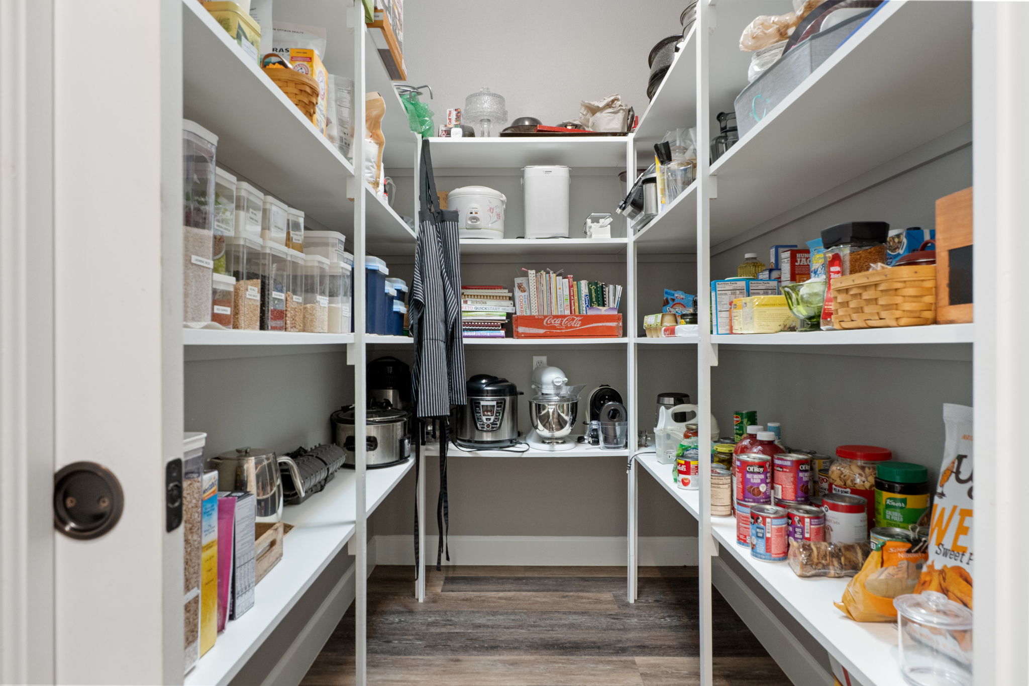 The large walk-in pantry with pocket door is a dream come true!
