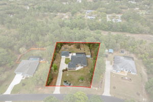 Surrounded by other stately homes, with a dry retention area behind, means no backyard neighbors!