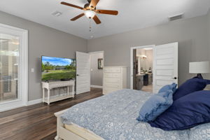 Opposite view of primary bedroom. Doorway in center leads out to great room. The door to the right of center leads to the primary bath and walk-in closet.