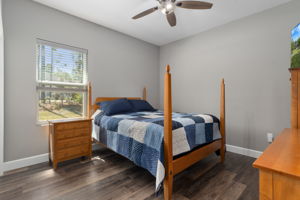 The middle guest bedroom can accommodate large furniture. On the left, outside of the picture, is a wall length closet.