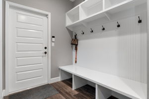 Just outside the pantry is the "mud room" hall. The closed door leads to the attached 2 car garage. The pantry is accessed on the left side, out of the picture.