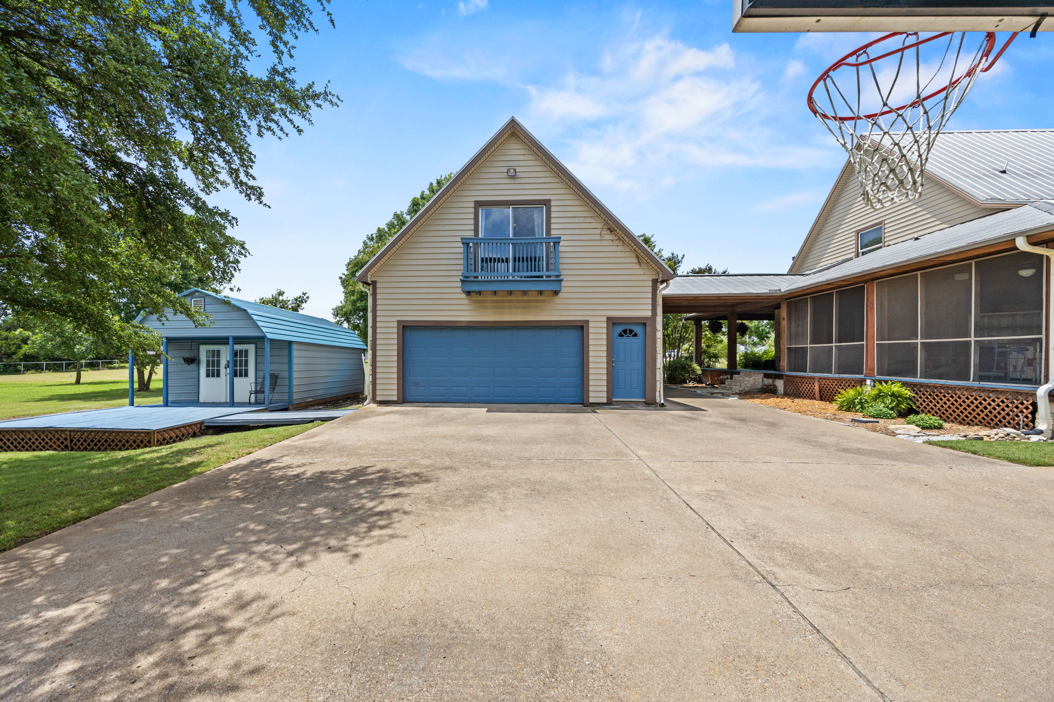 Garage and metal building provide ample storage