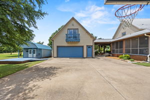 Garage and metal building provide ample storage