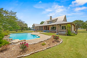 View of pool and back of house