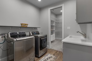 Laundry area attached to primary closet