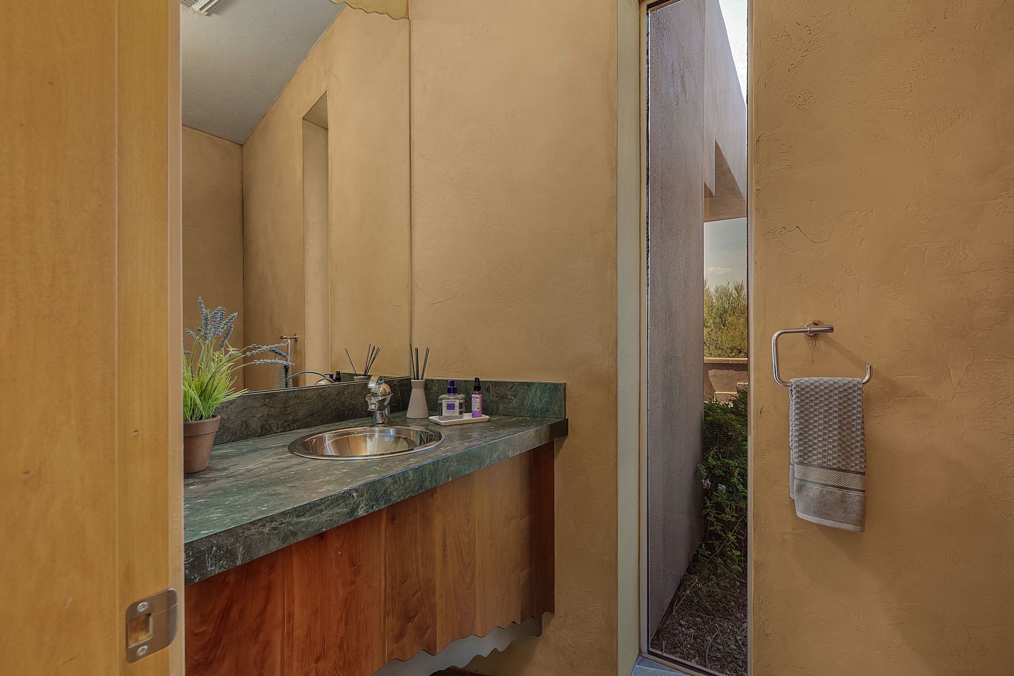 The Powder Room has a beautiful floating vanity with granite countertop.