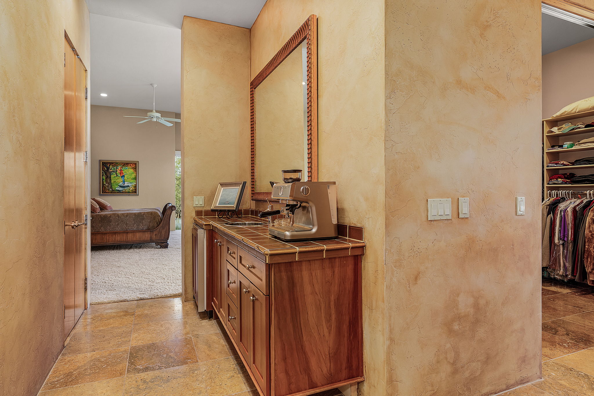 The wet bar/coffee bar is equipped with a mini fridge.